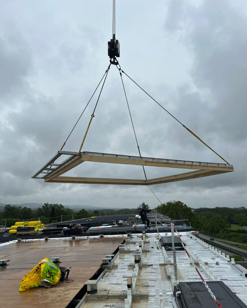 The first part of the retractable roof system being installed by crane